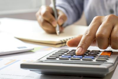 Person using calculator nano ceramic solar control window film