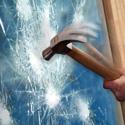 Hammer breaking glass window