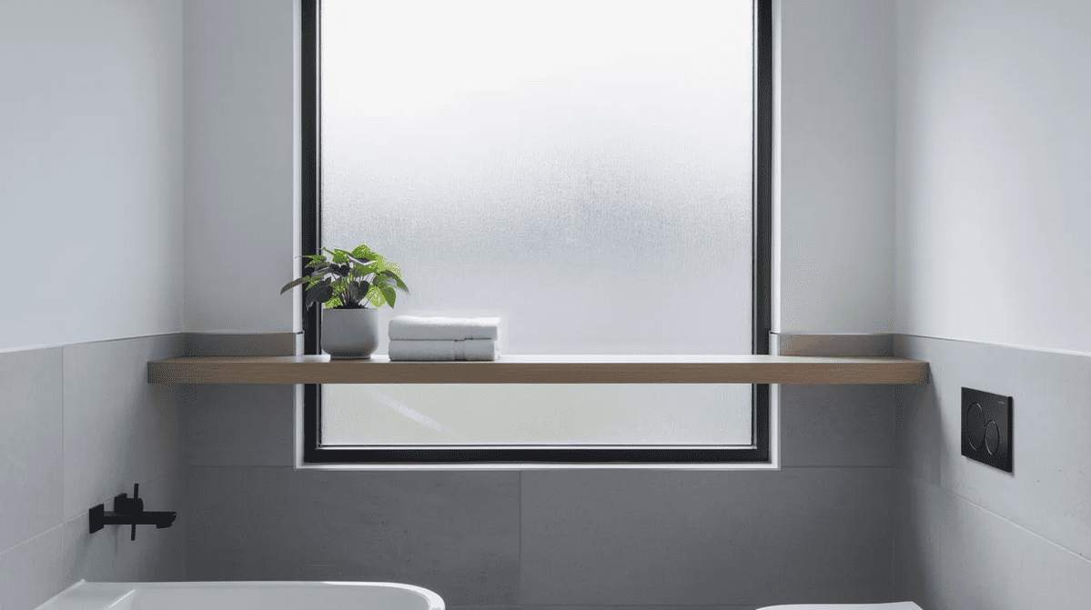 Frosted bathroom window A modern bathroom with a frosted window for privacy.